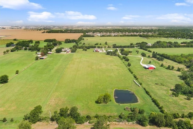 birds eye view of property with a rural view