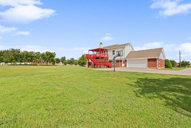 view of front facade with a garage, a wooden deck, and a front yard