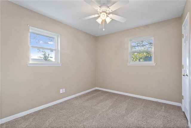 carpeted empty room featuring ceiling fan