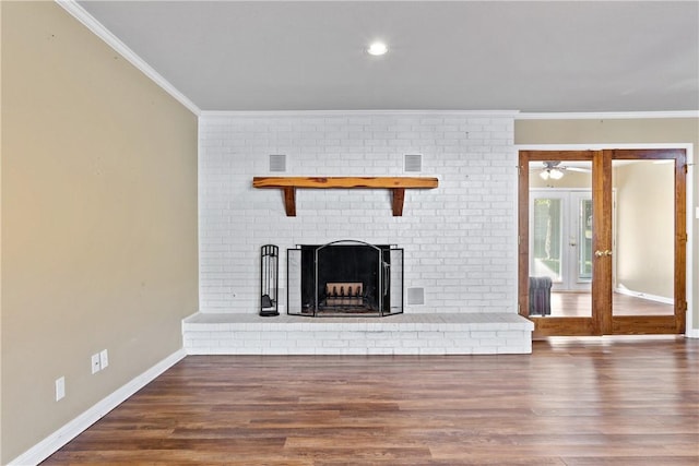 unfurnished living room featuring a fireplace, ceiling fan, dark hardwood / wood-style flooring, and crown molding