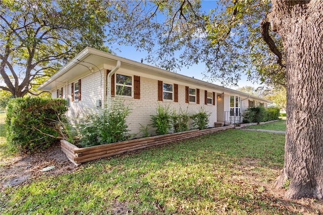 ranch-style house with a front yard