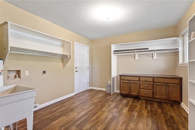 washroom featuring hookup for an electric dryer, washer hookup, cabinets, a textured ceiling, and dark wood-type flooring