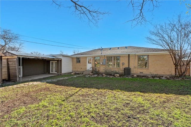 back of property featuring a lawn, central AC, a patio area, and french doors