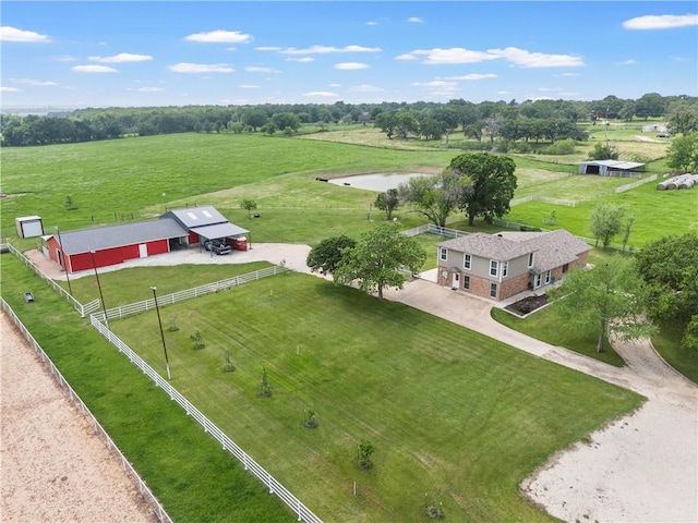 aerial view with a rural view and a water view