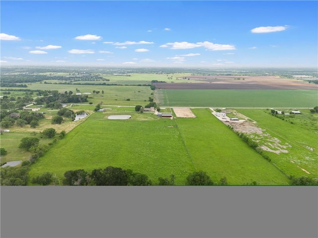 birds eye view of property with a rural view