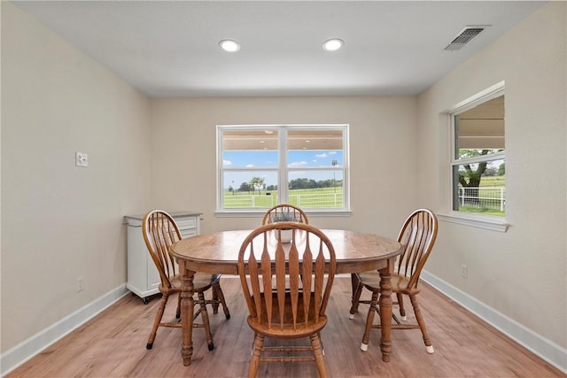 dining area with light hardwood / wood-style flooring