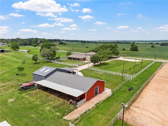 birds eye view of property with a rural view