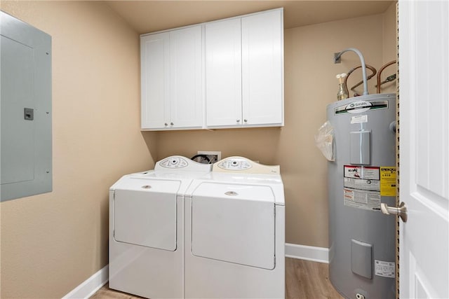 washroom featuring washer and clothes dryer, cabinets, electric panel, water heater, and light hardwood / wood-style floors