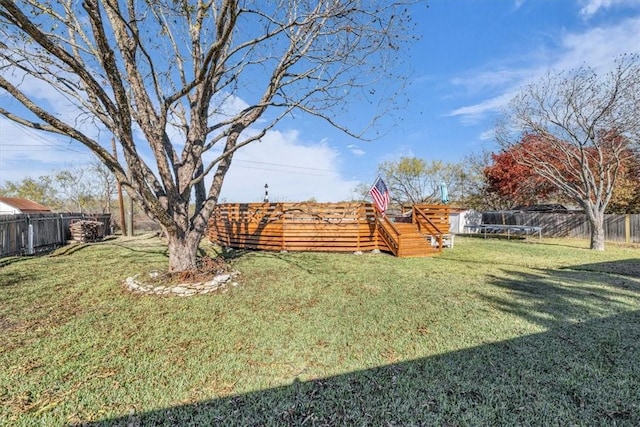 view of yard with a trampoline