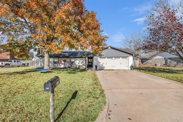 ranch-style house with a front lawn and a garage