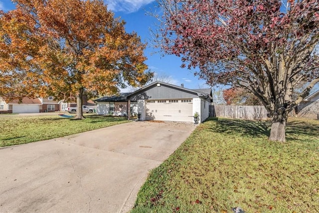 ranch-style house with a garage and a front yard