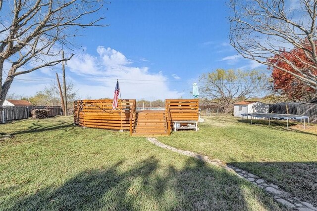 view of yard with a trampoline