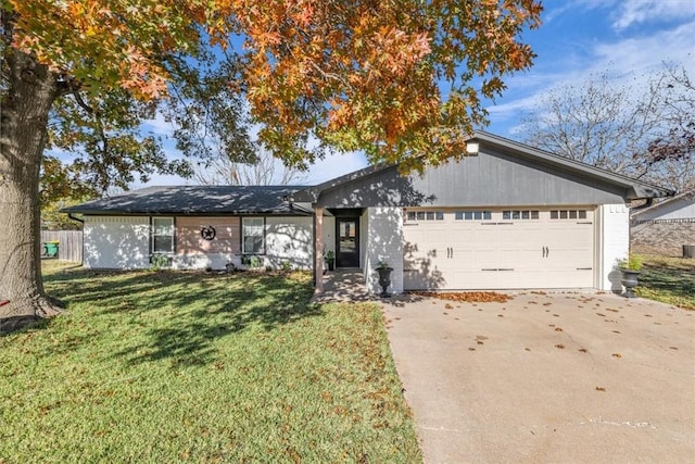 ranch-style house with a front lawn and a garage