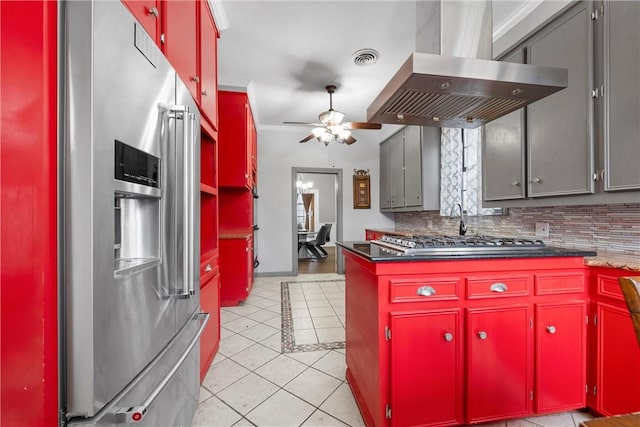 kitchen with light tile patterned floors, appliances with stainless steel finishes, backsplash, ornamental molding, and island exhaust hood