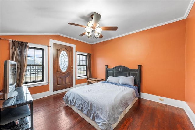 bedroom featuring lofted ceiling, ornamental molding, dark hardwood / wood-style floors, and ceiling fan