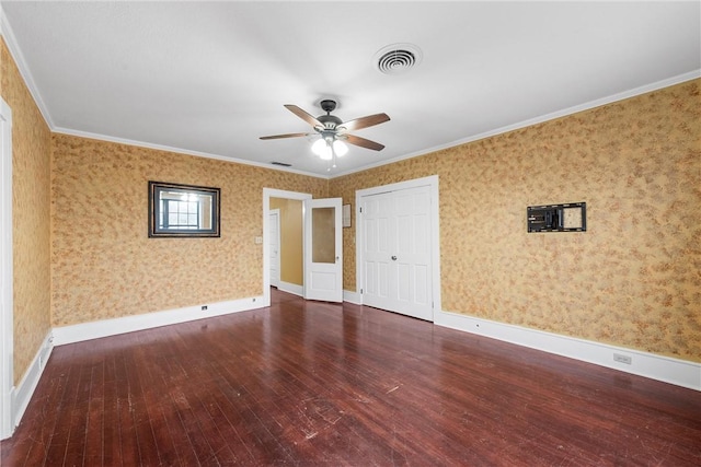 unfurnished bedroom featuring dark hardwood / wood-style flooring, crown molding, and ceiling fan