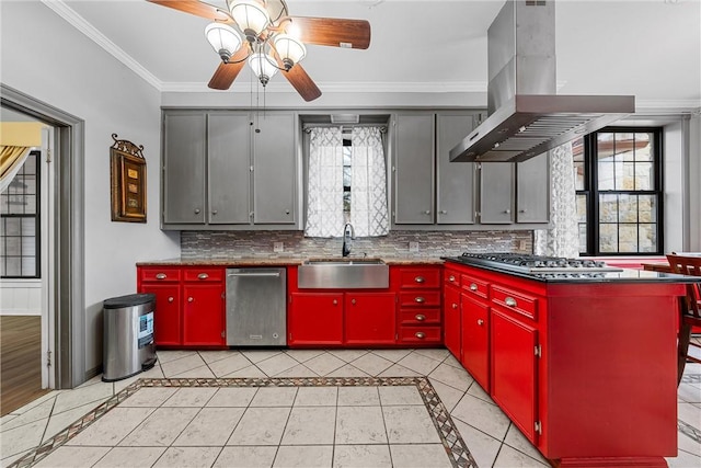 kitchen with appliances with stainless steel finishes, sink, island exhaust hood, light tile patterned floors, and a healthy amount of sunlight