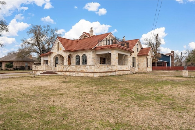 rear view of house with a lawn