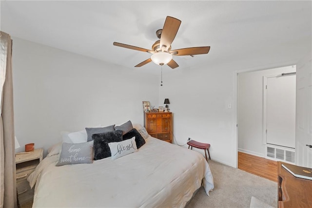 bedroom featuring ceiling fan and light hardwood / wood-style flooring