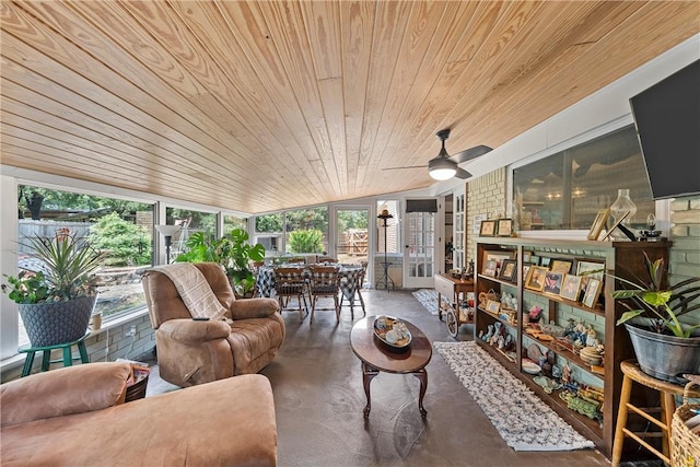 sunroom featuring a wealth of natural light, ceiling fan, wooden ceiling, and vaulted ceiling