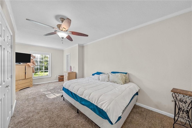 carpeted bedroom featuring a ceiling fan, baseboards, a textured ceiling, and crown molding