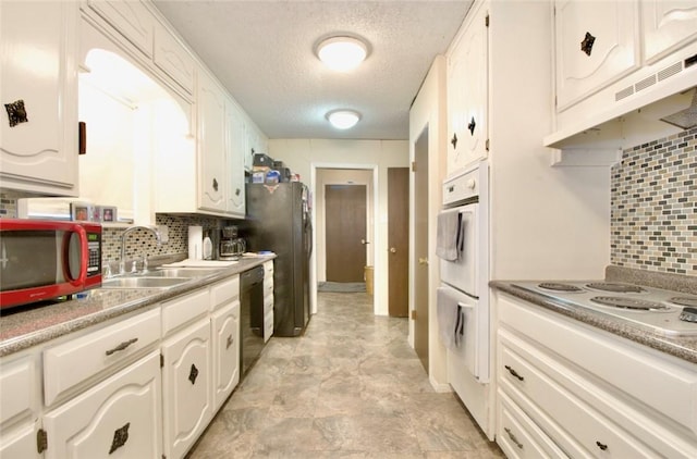 kitchen featuring white cabinetry, sink, white appliances, and backsplash