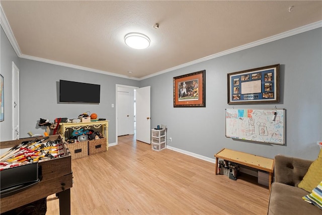 rec room with light hardwood / wood-style floors and ornamental molding