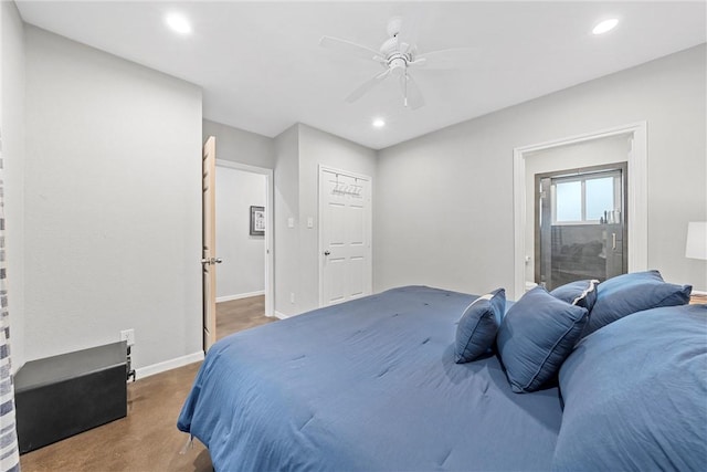 bedroom with dark colored carpet and ceiling fan