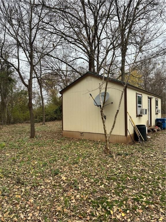 view of outdoor structure featuring central AC unit and cooling unit