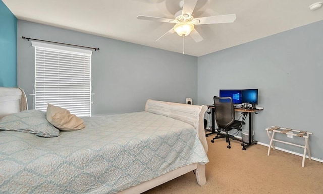 bedroom with ceiling fan and light carpet