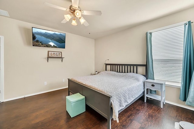 bedroom featuring ceiling fan and dark hardwood / wood-style flooring