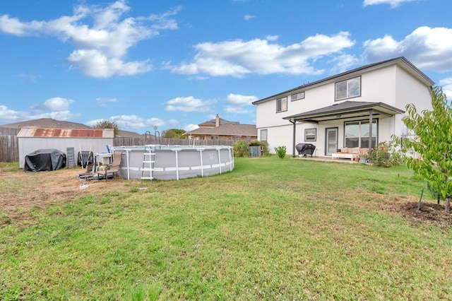 view of yard with a fenced in pool