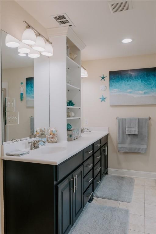 bathroom with vanity and tile patterned floors