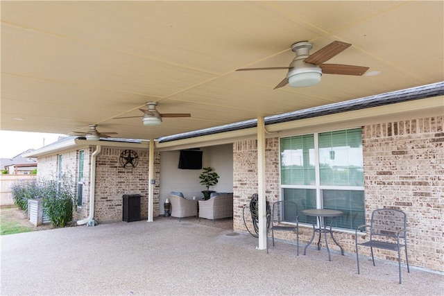 view of patio with ceiling fan and an outdoor hangout area