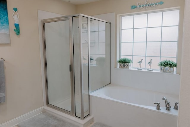 bathroom with a wealth of natural light and plus walk in shower