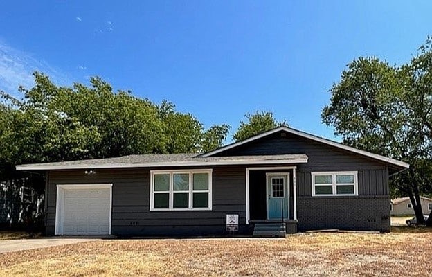 ranch-style house featuring a garage