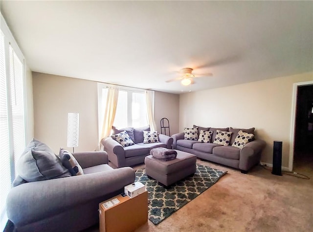 carpeted living room featuring ceiling fan