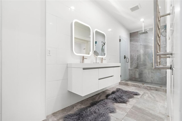 bathroom with vanity and walk in shower