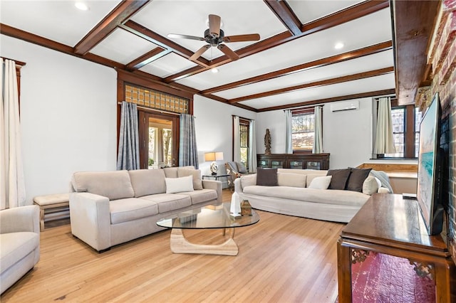 living room featuring ceiling fan, light hardwood / wood-style floors, beam ceiling, and a wall mounted AC