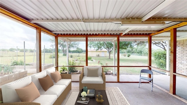 sunroom with a rural view and a healthy amount of sunlight