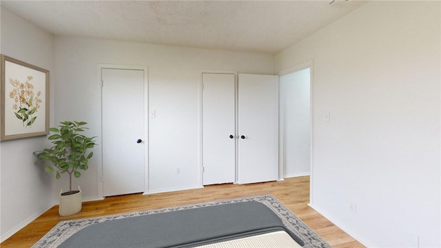 unfurnished bedroom with light hardwood / wood-style floors