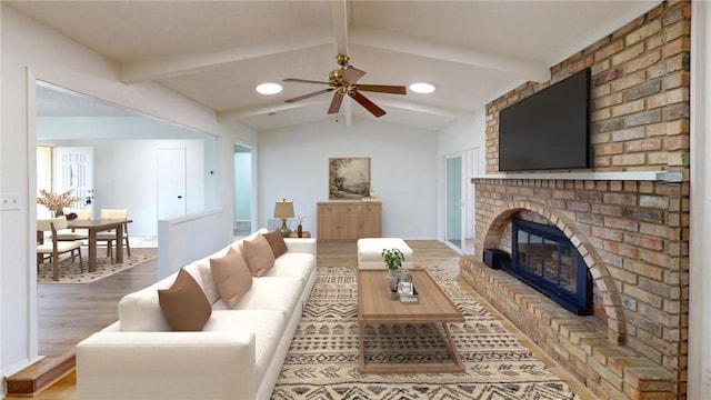 living room featuring ceiling fan, vaulted ceiling with beams, hardwood / wood-style floors, and a fireplace