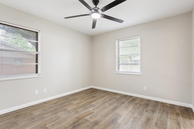 empty room featuring light hardwood / wood-style floors and ceiling fan