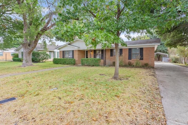 ranch-style house with a front yard and a carport