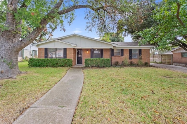 ranch-style house with a front lawn