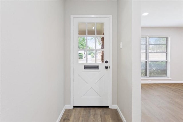 doorway to outside with light hardwood / wood-style floors