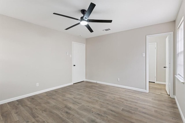 spare room with ceiling fan and light hardwood / wood-style flooring