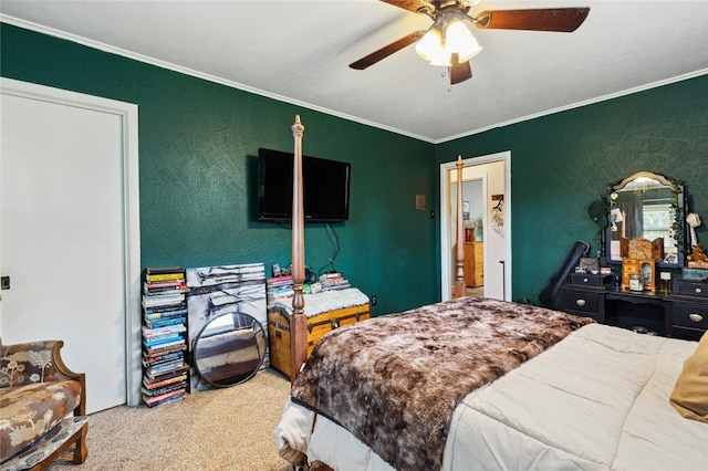 bedroom featuring ceiling fan, crown molding, and carpet floors