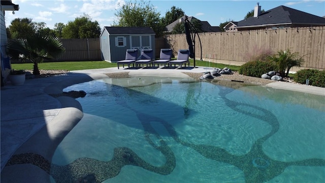 view of pool featuring a patio, a fenced backyard, an outdoor structure, a fenced in pool, and a shed