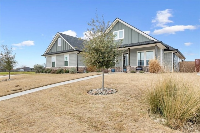 craftsman-style house with brick siding and board and batten siding